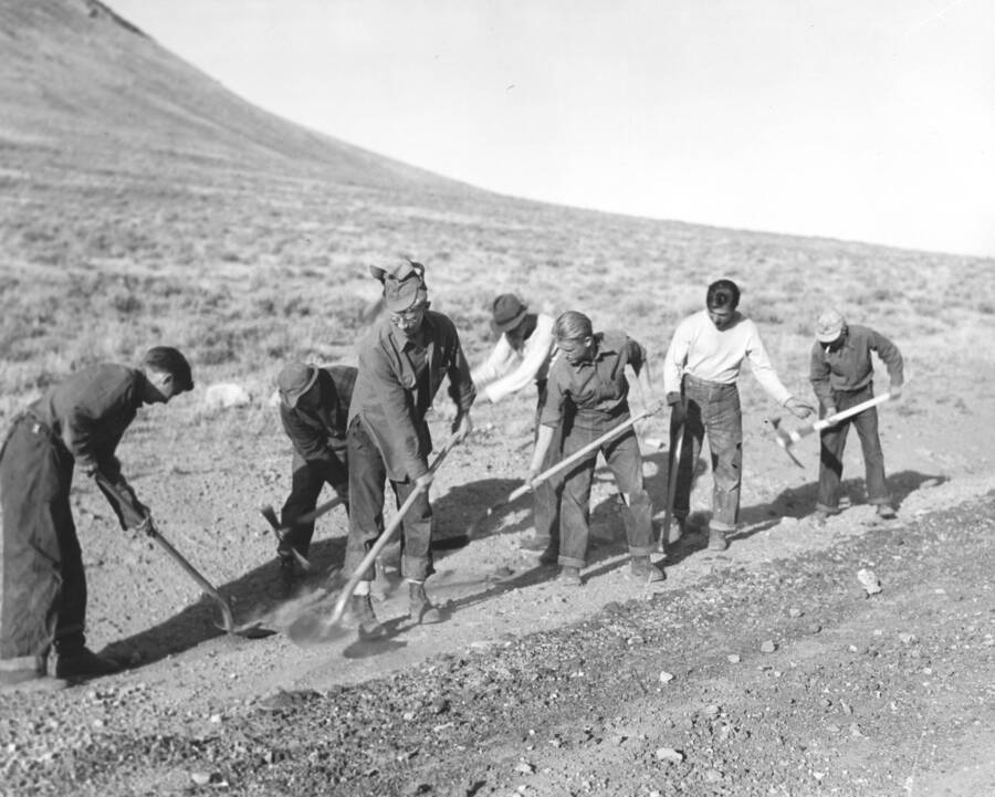 A group of CCC workers from Mountain Home Camp G-99 level at a roadside. Image part of CCC-Idaho Indian Division.
