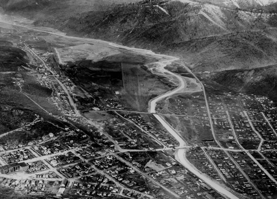 Broad aerial image of Kellogg, Idaho, Shoshone Airport site, and Coeur d'Alene River.