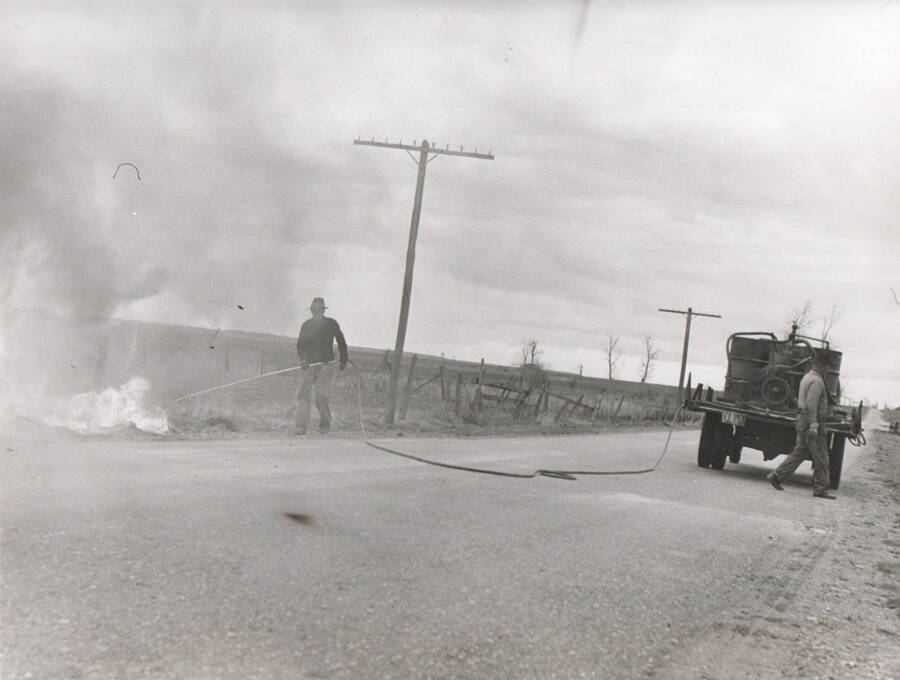 Photo text: 'Weed burning in Ada county by WPA (Idaho) noxious weed control workers. This control method is being emphasized, along with cultivation of infested fields, because of the shortage of chemicals formerly used, particularly sodium chlorates, now in great demand in the manufacture of ammunition.' Note: This image is part of a Work Progress Administration publicity series.