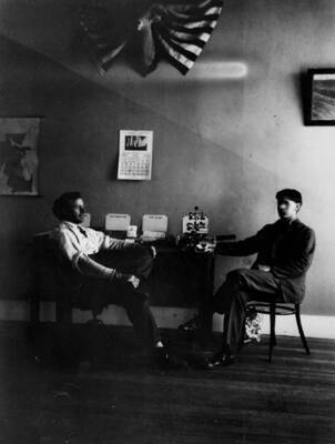 Photo text: 'Interior of First Supervisors Office in McCall. Supervisor Bergh and Clerk Walter Mann. July 1909.'