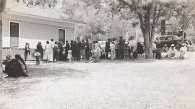Photo caption: 'Kamiah Farm Chapter has all day meeting. Lunch is served at noon.' This image is part of a report regarding farm organizations among tribes in Northern Idaho and the CCC-Indian Division.
