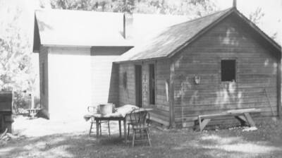 Photo caption: '[Conley Seth house] A new foundation, a new floor and an addition built on. All Indian labor.' This image is part of a report regarding farm organizations among tribes in Northern Idaho and the CCC-Indian Division.