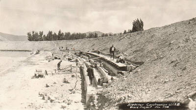 Construction of the bleachers for the Stadium at the University of Idaho - Southern branch now the Quad at Idaho State University. Note: This image is part of a Work Progress Administration publicity series.