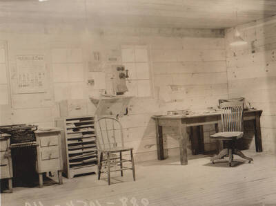 Photo text: 'Camp and construction scenes at Wallace Flood Camp to dredge and straighten channel of Coeur d'Alene River. Single men's camp.' Note: This image is part of a Work Progress Administration publicity series.