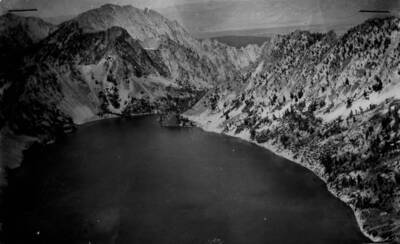 Photo text: 'Sawtooth Lake, looking northeast across Salmon River Valley. Lake about one mile line stocked with Sunapee Trout in 1925.' This image is part of a report by the United States Department of Agriculture Biological Survey and the Wildlife Management Division.