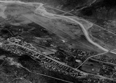 Aerial image of Shoshone County Airport in Kellogg, Idaho. Includes survey makings and measures.