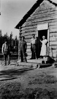 Men and woman pose outside Chamberlain Ranger Station
