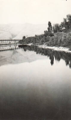 Photo text: 'Snake River. Scows at anchor near Lewiston, Idaho. About 200 ft. below interior warehouse. Gage 0.2. Aug. 30, 1930.' This image is part of a Rivers and Harbors series.