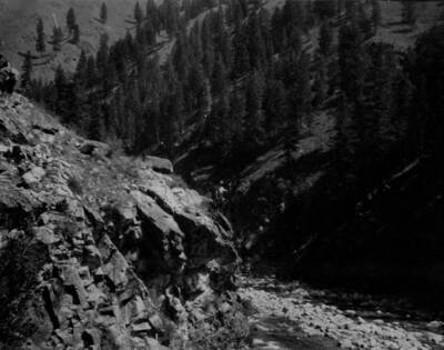Man stands on point over Salmon River on Crevice Trail