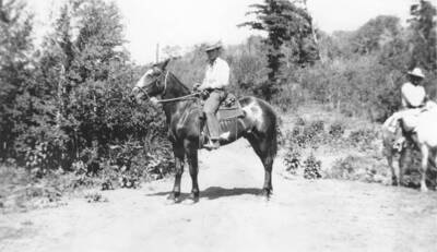 Photo text: 'Indian field party distributing poisoned grain in ground squirrel control work on the Fort Hall Indian Reservation.' This image is part of a report by the United States Department of Agriculture Biological Survey on predation and pests.
