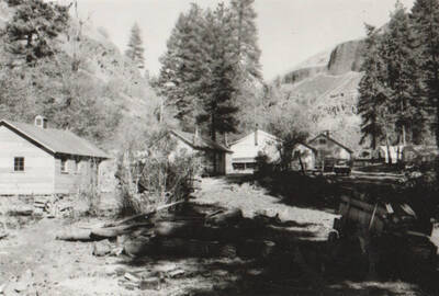 Photo text: 'Cottonwood Camp - Camp and construction scenes on Graves Creek farm-to-market road in Idaho County. Single men's camp.' Note: This image is part of a Work Progress Administration publicity series.