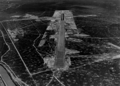Aerial image of an 'improved' meaning graded or paved, airstrip or runway at Boise Airport.