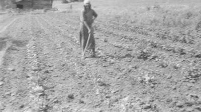 Photo caption: 'Mary Spencer, living above Kooskia, has a good big garden.' This image is part of a report regarding farm organizations among tribes in Northern Idaho and the CCC-Indian Division.