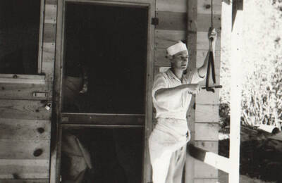 Photo text: 'Cottonwood Camp - Camp and construction scenes on Graves Creek farm-to-market road in Idaho County. Single men's camp.' Note: This image is part of a Work Progress Administration publicity series.