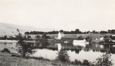Photo text: 'Snake River. U.P. Steamboat landing showing Str. Lewiston at the dock near the interior warehouse. On the Washington shore looking towards Idaho. Aug. 30, 1930.' This image is part of a Rivers and Harbors series.