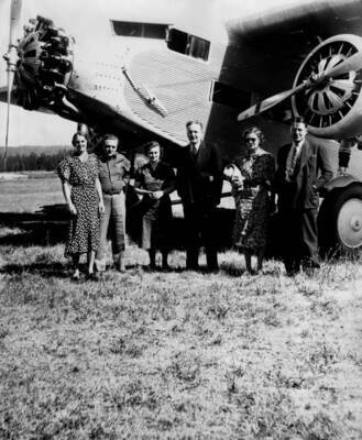 Photo text: 'Party headed by Congressman D. Worth Clark at Chamberlin Ranger Station after a 40 minute flight into the area.'