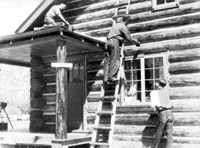 Photo text: 'Boys from Red Fish Lake Camp painting Challis R.S. NY City versus Idaho.'