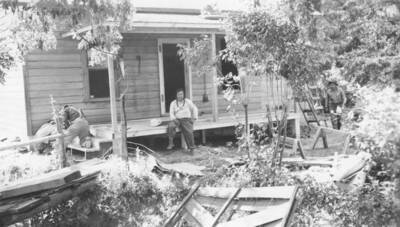 Photo caption: 'Same house [Conley Seth] one month later. Work about complete. All Indian labor.' This image is part of a report regarding farm organizations among tribes in Northern Idaho and the CCC-Indian Division.