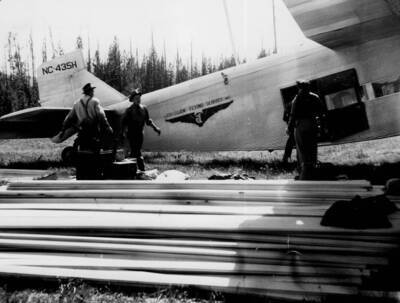 Unloading supply plane at Chamberlain Ranger Station