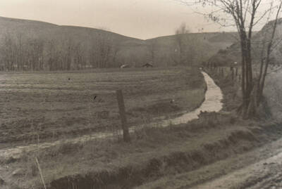 Government irrigation ditch near the Fort Lapwai Sanatorium. Sanatorium is not visible. Note: This image is part of a narrative pictoral report to accompany quarterly enrollee program report.
