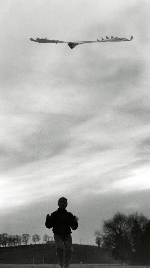 Sean Burgess flying a kite at Guy Wicks Field. Caption: '[Wicks Field / Sunday] Sean Burgess 12 yr / father, Barry Burgess 5th Arch.'