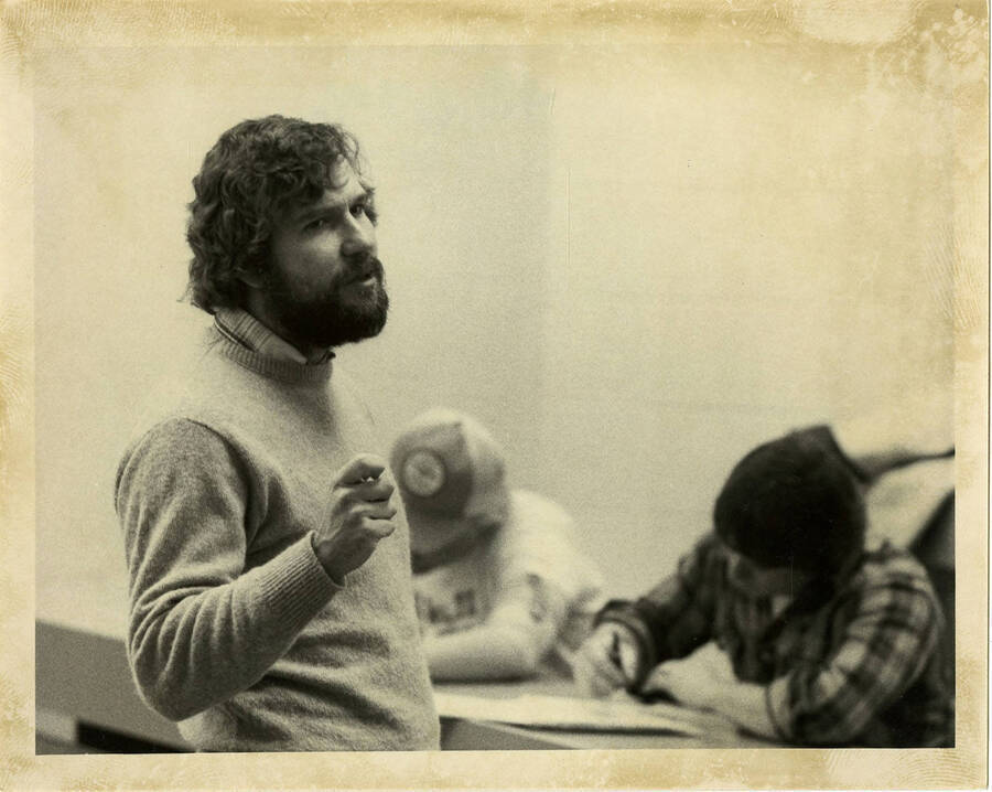 Don Crowley, emeritus professor of Politics and Philosophy, teaching in a classroom.