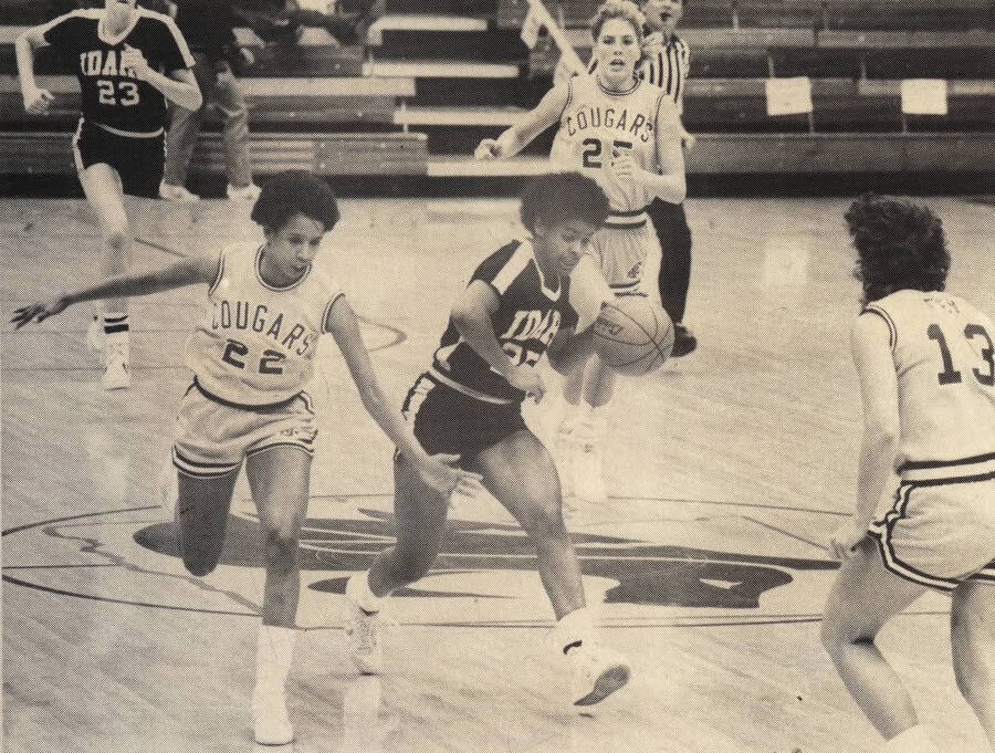 Vandals Women's Basketball player Netra McGrew (25) driving the ball down the court in a game against the Washington State University Cougars.