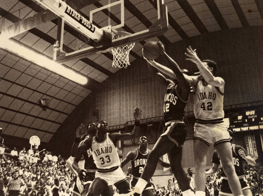 Steve Adams (33) Robert Blair (42) going up against the Boise State Broncos during a basketball game.