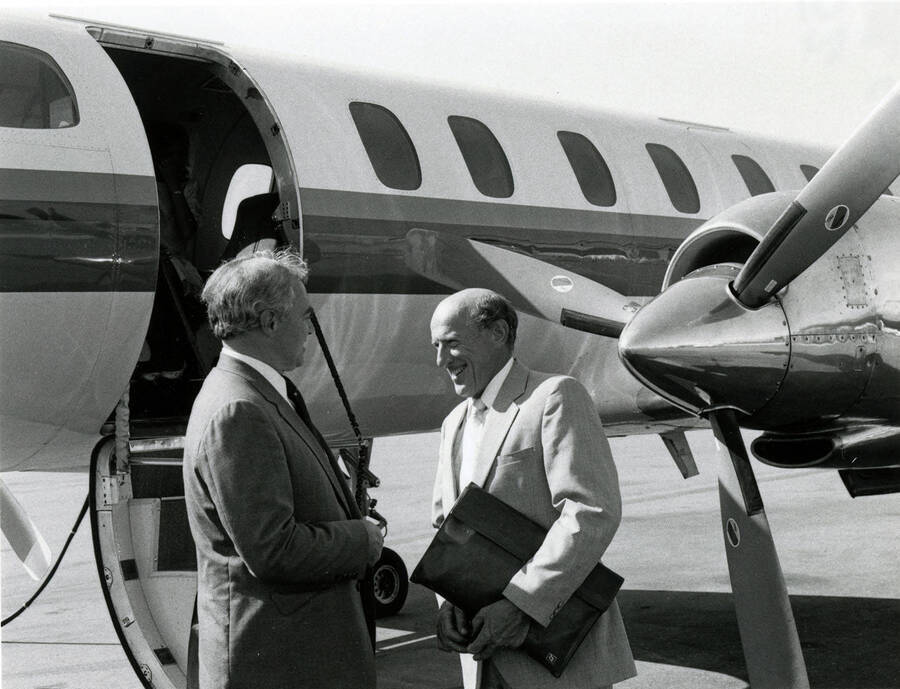 President Gibb (right) and Law Dean Vincenti (left) boarding an airplane.