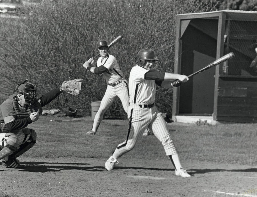 Students playing baseball.