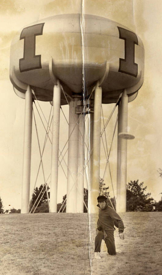 Student posing by the U of I water tower.