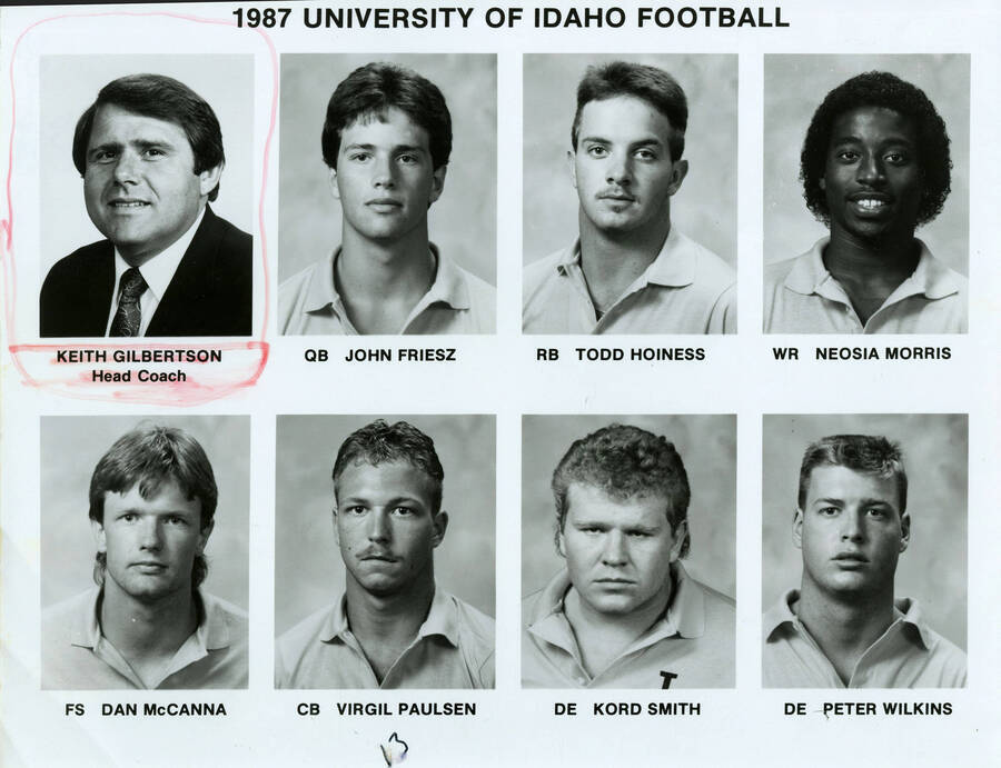 1987 University of Idaho Football. From left to right: Keith Gilbertson, Head Coach; John Friesz, QB; Todd Hoiness, RB; Neosia Morris, WR; Dan McCanna, FS; Virgil Paulsen, CB; Kord Smith, DE; and Peter Wilkens, DE. Keith Gilbertson is highlighted.