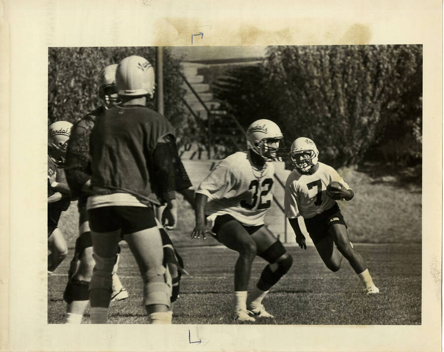 John Jake #7 - receiver, Damon Daniels #32 - rb Idaho football team practicing.