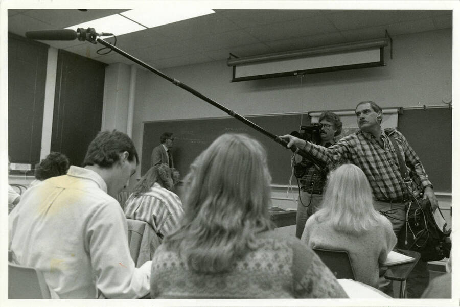 Film crew record students in a classroom.