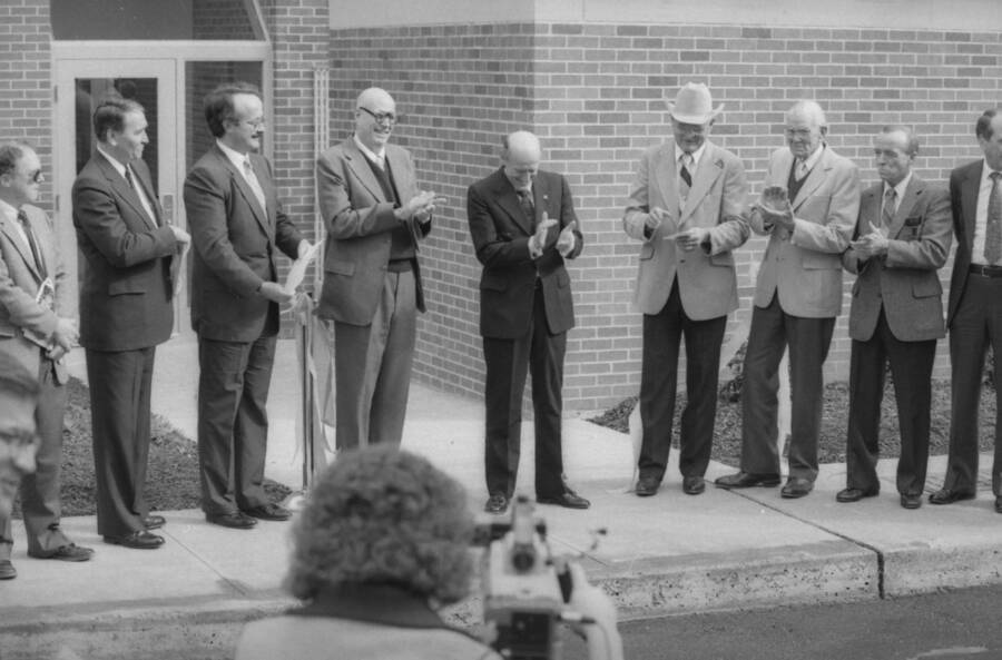 President Gibb (center) with others after cutting the ribbon on a new campus construction project.