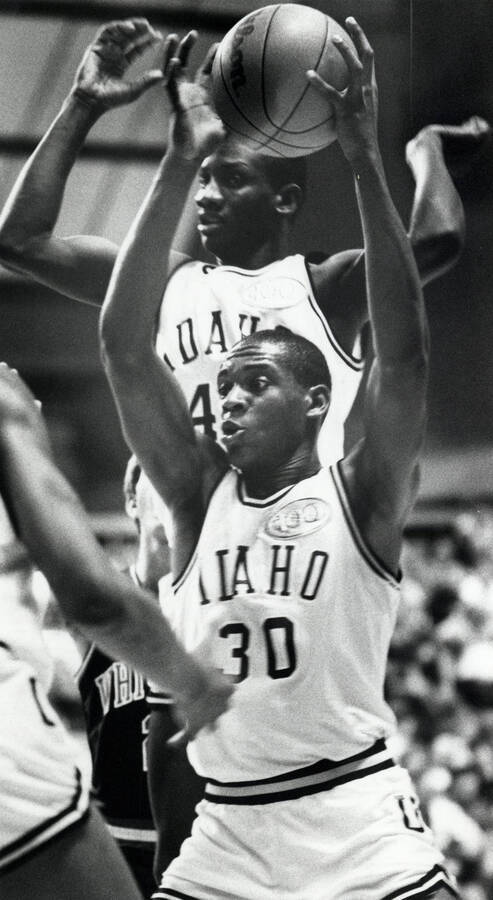 Idaho forward Ricardo Boyd and Clifton Jones (with ball) in a win over Whitman College on Dec. 7, 1988 at the Kibbie Dome.