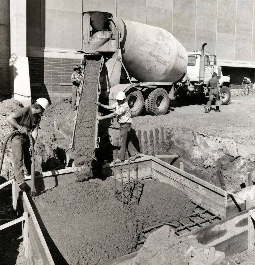 Workers pouring the foundation for the Kibbie Dome annex.