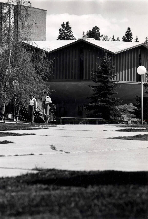 Students walking by Kiva, College of Education Building.