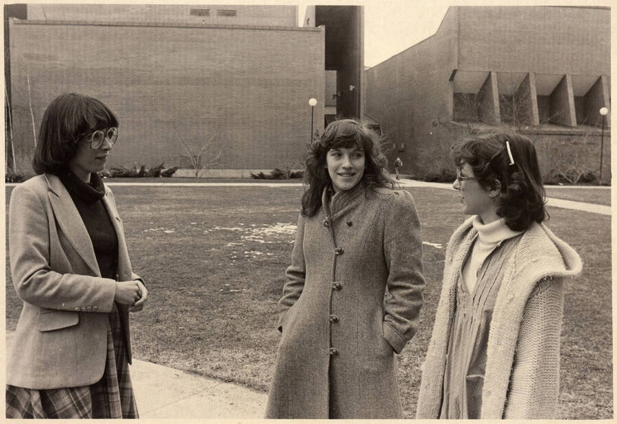 Alumni  Assistant Director Mary Kay McFadden (left)  with two female students outside of the Physical Education Building.