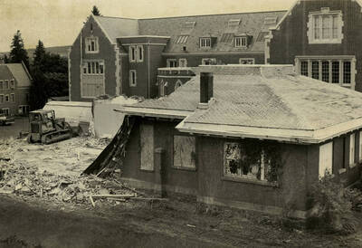An old building being demolished to make space for the new Life Sciences addition.