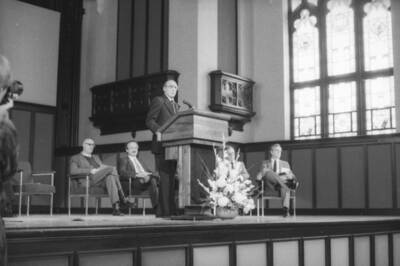President Gibb speaking at a podium.