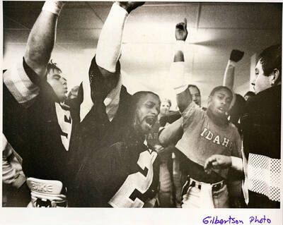 Vandal standout wide receiver Eric Yarber (in T-shirt) along with running back Bruce Harris (No. 2 jersey) celebrate another win by singing the Idaho fight song in the locker room.