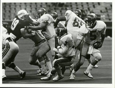 Eagles football players defending the ball.
