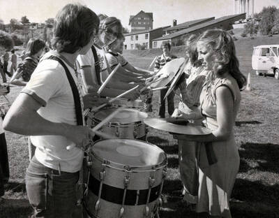 Percussionists practicing outdoors.