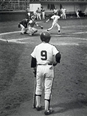 Students playing baseball.
