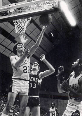 Gordie Herbert (20) shooting a layup against the Weber State Wildcats.