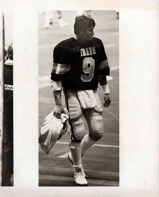 Vandal quarterback Ken Hobart walks off the Kibbie Dome turf.