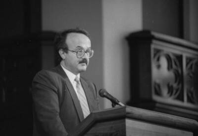 A man speaking at a podium.