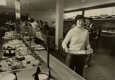 Students getting food in the cafeteria.