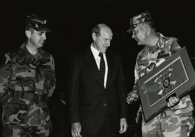 President Gibb (center) with two soldiers. Man on right holding plaque with the name of E.R. Chrisman (1866-1939).